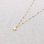 Collier en acier émaillé avec pendentif étoile: Beige